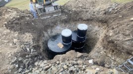 finished septic tanks visible in ground.jpg