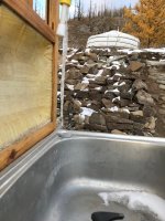 frozen sink with ger and rocks in background.jpeg