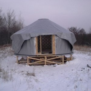 My little bother is nearly 7 feet tall and he was instrumental in getting the cover up over the top of the yurt.