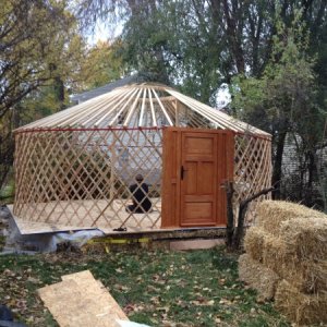 Squarish platform with yurt frame.