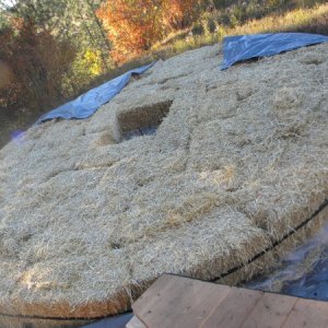 Gaps in full bales filled in. Hole in center for sturdier/unburnable foundation under wood heater.