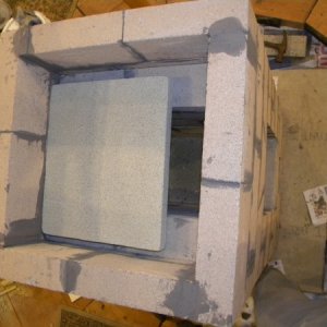 Firebox with vermiculite baffle on top.