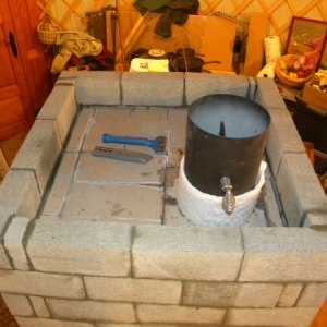 The very top. To be capped/filled with perlcrete & mortar.