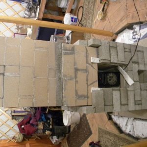 Concrete brick facing partially complete. ~1/4" air gap maintained between the core & facing using cardboard, which is removed after the mortar sets. 