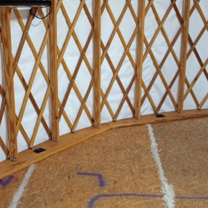 The picture highlights the base blocking under the Yurt frame. Base blocking provides a number of advantages - including raising the overall Yurt heig