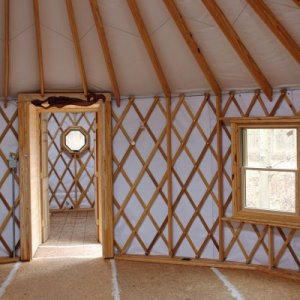 View through the hallway into the twelve foot Yurt. The smaller Yurt will be the bathroom, water heater, and electrical distribution.