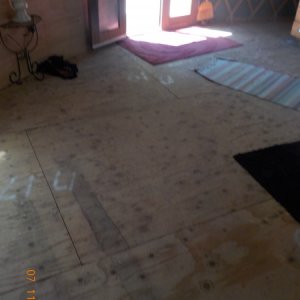 Unfinished floor, looks like it has water damage