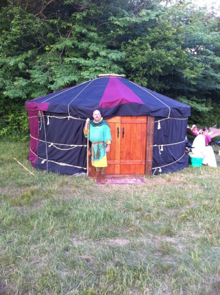 A friend from the Ren Fair posing in front of the yurt at a 9 day event north of KC.