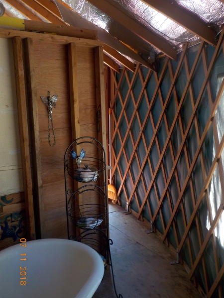Bathroom area with clawfoot tub