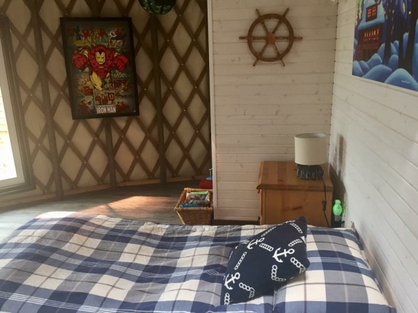 Bedroom 1 with 8x2.5 closet, dresser, desk and queen bed.