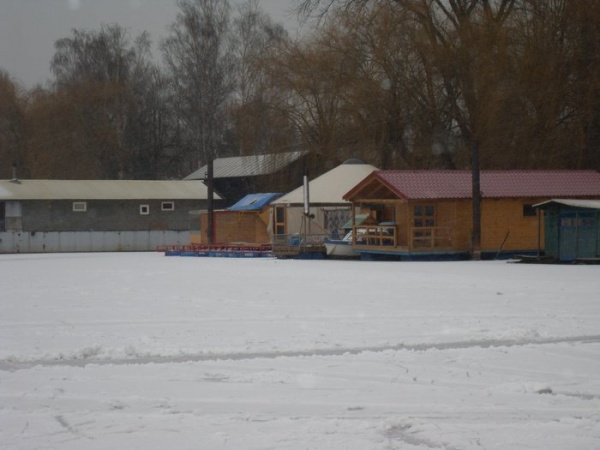 Completed yurt floating on a frozen river.