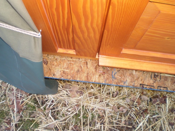 Faux pas! Platform sticks out past the door--good way to get water-saturated OSB. With some time, freezing, warmth it may auto-regulate to flush with 