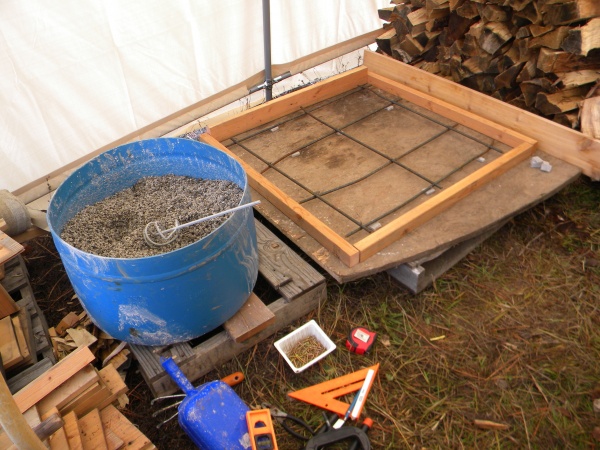 Form with 3/8 rebar reinforcement. Bin with perlite & expanded shale aggregate for a lightweight yet reasonably strong concrete.