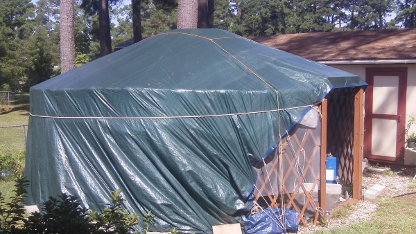 I've covered it with a 30x50ft tarp until I could afford to buy the Solex insulated greenhouse panels to cover it with. My plan is to get my tilapia t