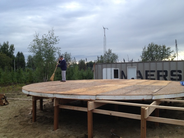 Juanita sweeps off the dust before we put the winter cover on the 4 inch home made SIPS.  For  now we will stay in the CONNEX Cabin.