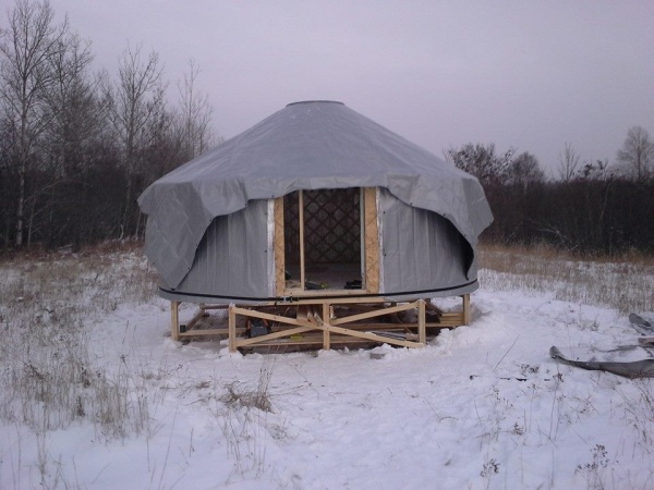 My little bother is nearly 7 feet tall and he was instrumental in getting the cover up over the top of the yurt.