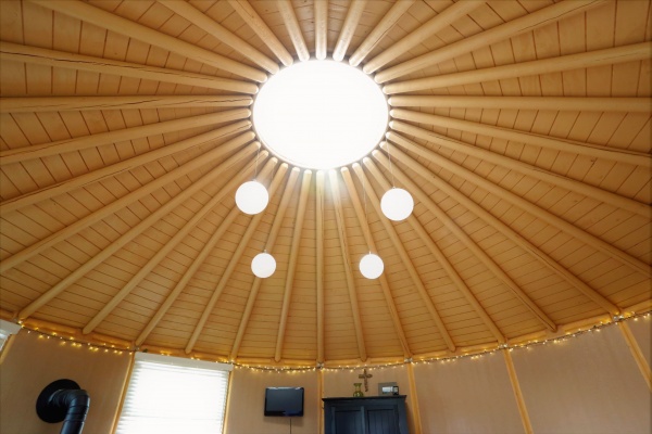 Our unique log rafters and wood ceiling, combined with wood walls, give our yurt a distinct cabin feel