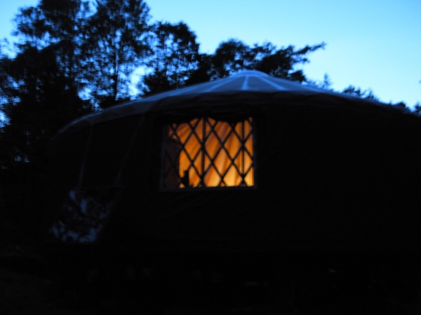 Pic of the yurt from outside at night.