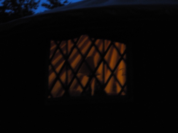 Pic of the yurt from outside at night.