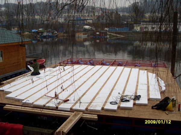 Platform joists and insulation are added for the yurt platform.