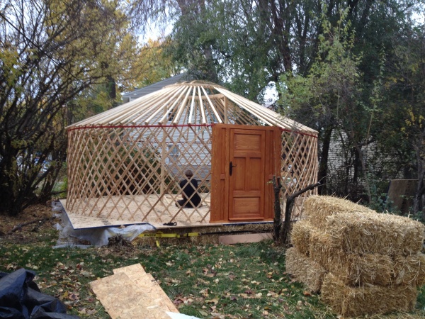 Squarish platform with yurt frame.