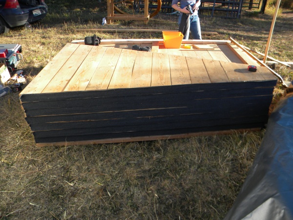 Stack of platform sections with felt stapled to the edge to form a somewhat air-seal.