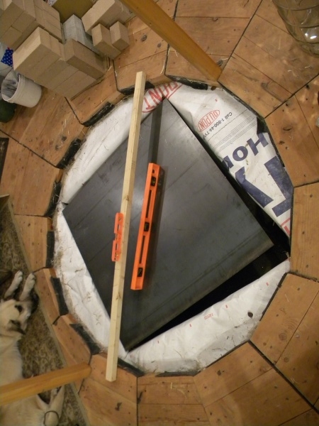 Steel sheet on top of cinder blocks but under concrete for distributing load.