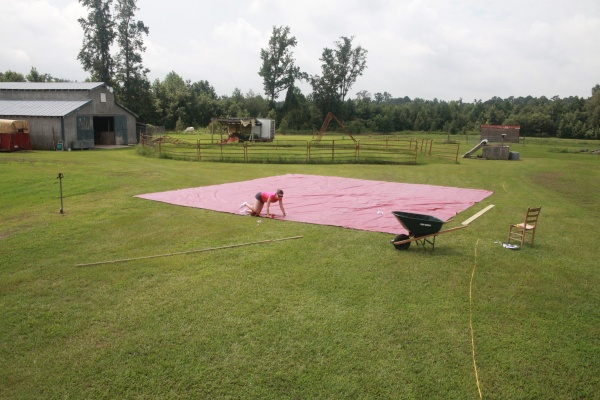 the 32 x 32 vinyl  is being  cut to the cone shape for the roof.