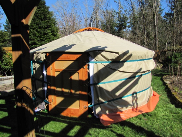 The front view of our Ger with out the crown cover in place, and the ground skirt not tucked in. This was a trial set up before taking off camping.