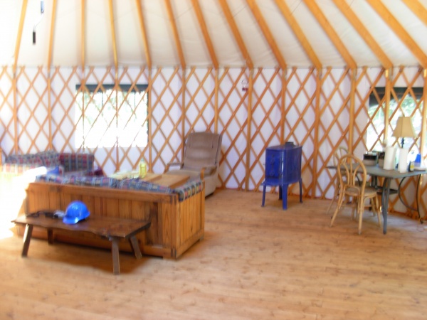 The "living room" at the yurt with the new stove.