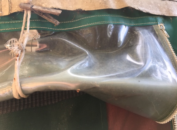Top of window, rolled up. Original straps to hold it up deteriorated.