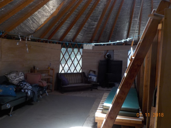 Unevenly spaced rafters, insulation falling down from ceiling, uneven walls
