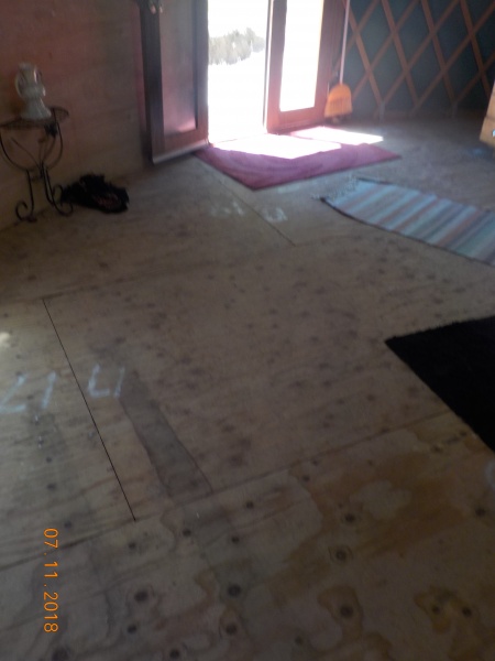 Unfinished floor, looks like it has water damage