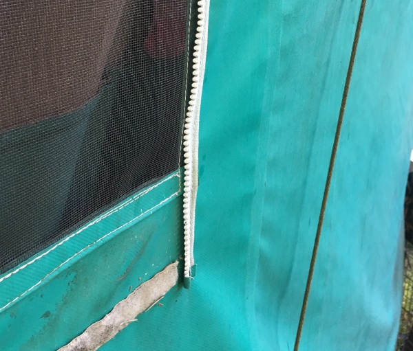 Velcro bottom & side zipper of window.