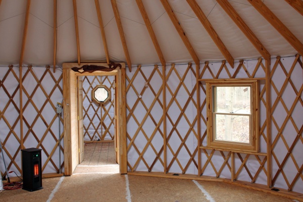 View through the hallway into the twelve foot Yurt. The smaller Yurt will be the bathroom, water heater, and electrical distribution.