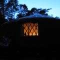 Pic of the yurt from outside at night.