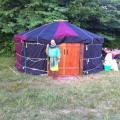 A friend from the Ren Fair posing in front of the yurt at a 9 day event north of KC.