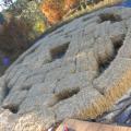 Complete bales placed on tarp. Ground was roughly leveled, then gravel placed on it, compacted, & leveled.