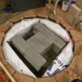 Cinder blocks sitting on leveled sand.