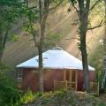 A 27' Big Sky yurt nesteled in the woods of Iowa.